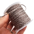 Detail of coffee and white twisted cotton cord on a spool for DIY jewelry crafts - Approx. 2.0mm / Coffee and White