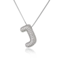 Macro shot of silver letter J pendant with micro-paved zircons and square box chain - Letter J
