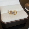 Macro detail of 18K gold plated bow-tie ring with cubic zirconia on a luxury box - Double T Geometric Zirconia Ring (11#)