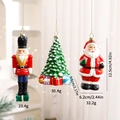 Three assorted resin Christmas ornaments featuring Santa, nutcracker, and a decorated tree - Display Set 4 (4 PCS)