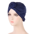 Close-up of navy blue turban hat showing braided texture and floral knot details - Navy Blue