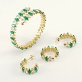 Macro detail of 18K gold stainless steel jewelry set with marquise green gemstones - Clear and Green