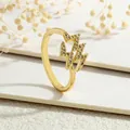 Macro shot of gold lightning bolt rings with micro-pave cubic zirconia on white steps - Lightning Style (RG0165-A)