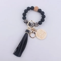 Detail of MAMA beaded keychain bracelet with black silicone beads and leopard print accents - Black
