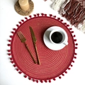 Detail of red woven coaster with gold thread and small pompoms on a set table - 38cm Placemat / Red