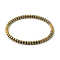 Detailed view of the gold and black striped stainless steel bangle with a secure clasp closure - Black