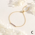 Detail of adjustable gold slider bracelet with sparkling purple cubic zirconia stones - Gold with Purple Zirconia