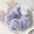 Lavender purple fluffy faux rabbit fur scrunchie on a decorative white porcelain plate - Light Purple
