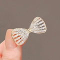 Elegant gold bow brooch featuring hollow design and sparkling rhinestones on metal - 67# Rhinestone Bowknot