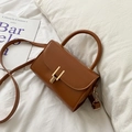 Brown vintage faux leather crossbody square bag with gold buckle on a white background - Tan
