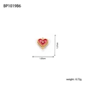 Detail view of heart pendant with red enamel, gold wavy edge and white zircon stone - Red