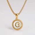 Detailed close-up of a gold stainless steel round necklace featuring a white shell letter G - Letter G