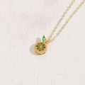 Chic gold-plated necklace featuring a detailed lemon pendant with sparkling green zircon stones - Lemon