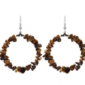Close-up of bohemian hoop earrings with irregular brown natural stones and silver hooks - Tiger Eye