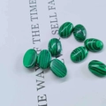 Polished oval malachite gemstone cabochons with green and black striped patterns - 6*8mm / Malachite (Synthetic)