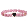 Bracciale di perline in pietra occhio di gatto rosa con pendente a cuore nero e oro - Pendente a Cuore Nero / Nero