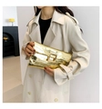 Detail of gold crocodile embossed envelope clutch with a large square metal buckle closure - Gold