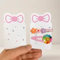 Pink bow cardboard display cards for colorful flower hair clips and sunflower hairpins - Approximately 100 Kp570s