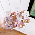 Detail of fabric bow and floral hair ties set on white display cards for girls - 5 Pairs Set / Purple