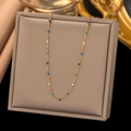 Gold layered necklace with colorful enamel beads and cross pendant on display - AH197 Blue Gradient Enamel Gold