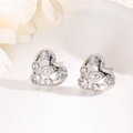 Macro detail of silver heart stud earrings with multi-cut cubic zirconia in a white tray - Multi-shape Zirconia Cluster-Silver
