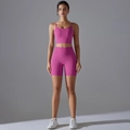 Detail view of the elastic magenta yoga set with high-waist shorts and crop top vest - S / Lychee Pink