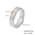 Silberner Edelstahlring mit Textur und herzförmigem champagnerfarbenem Glasstein - US 6 / Silber/Weiß