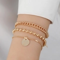 Three-piece layered golden bracelet set featuring curb chain and round pendant charm - Gold-1