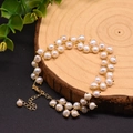 Elegant natural pearl bracelet with golden lucky charm and adjustable chain closure - White Pearl Branch Double Bracelet