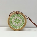 Handwoven round rattan bag featuring green and white shell inlay with brown leather strap - Green Grape