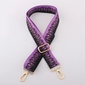 Detailed view of purple and black flame pattern woven strap with gold metal hardware - Purple Black Flame