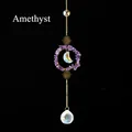 Hanging amethyst suncatcher with golden sun and moon charms and a faceted crystal ball - Amethyst