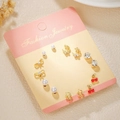 Golden titanium steel stud earrings set featuring bow, cherry, and moon designs with pearls - Gold Pearl Cherry (E1885-1)
