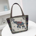 Ethnic woven tote bag featuring a colorful elephant pattern and sturdy dual handles - Off-White Head-Up Elephant
