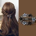 Elegant vintage alloy spring clip featuring black and blue rhinestone flowers for ponytails - 6cm - Hollow Flower Spring Clip