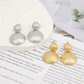 Macro detail of gold and silver textured metal earrings with vertical grooved patterns - Gold EH012 (Striped Double Sphere)