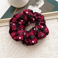 Detail of red and black plaid scrunchie with white snowflake print for festive hairstyles - Red Black Plaid Snowflake Print / Christmas Red