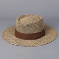 Close-up of wide-brim straw hat featuring hollow weave texture and brown fabric ribbon - M (56-58cm) / Coffee