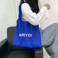 Detail of Klein blue canvas tote bag with white AREYOU letter print for daily commute - Klein Blue