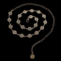 Close-up of gold chain belt with crystal-encrusted circles and rose charm - Gold Rhinestone Loop Rose (Style 10)
