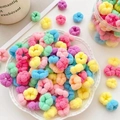 Pastel candy-colored seamless elastic hair ties in a decorative white ceramic bowl - Multicolor