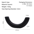 U-shaped black ceramic vase with a minimalist matte finish and abstract modern design - Matte Black - Style K