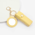 Detail of yellow PU leather lipstick holder with mirror and golden keychain accessory - Yellow