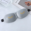 3D contoured gray sleep mask with yellow eyelash print on white plush surface - Gold Stamping Eyelash Style / Gray