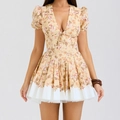 Floral mini dress with deep V-neck, puff sleeves and pleated hem detail in yellow - S