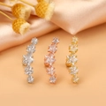 Close-up of star shaped cartilage earrings with zircon stones in silver, gold and rose gold - Style 9