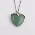 Green heart-shaped gemstone pendant necklace with silver twisted chain on grey background - 60cm Twist Chain / Green / Aventurine