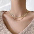 Double-layered gold snake chain and beaded necklace on a beige knit sweater - Double Layer Snake Bone Box Chain / Gold