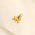 Macro shot of gold-plated stainless steel initial M pendant with a smooth polished finish - Letter-M