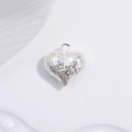 Detailed macro view of S925 silver heart pendant with 3D embossed floral patterns - Silver Floral Pattern Heart Pendant